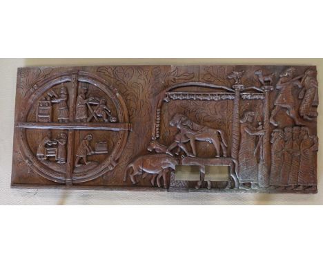 A decorative carved wooden panel, 75x179x6cm.