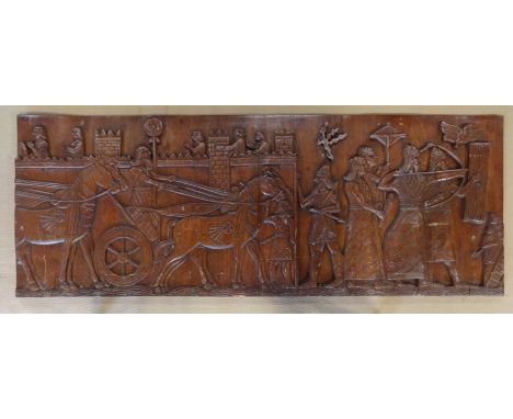 A decorative carved wooden panel, 75x198x6cm.