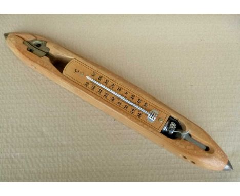 Bobbin shaped thermometer.