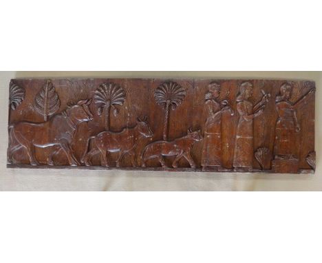 A decorative wooden carved panel