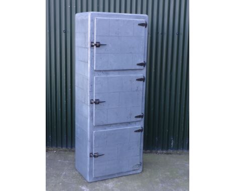 A vintage industrial zinc effect cabinet on wheels with three drawers, 197cm x 75 x 48cm.