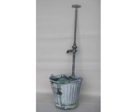 Galvanized bucket and pipe.