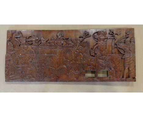 A decorative carved wooden panel, 75x179x6cm.