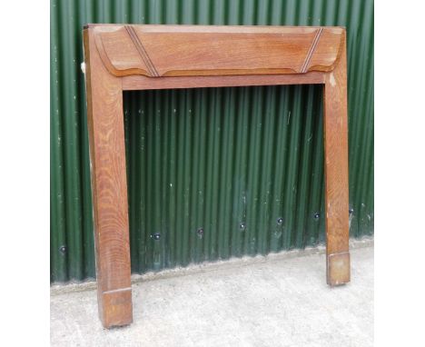 Old brown wooden fire surround.