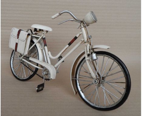 A group of twelve scale model white bikes, 17x29x9cm. (12)