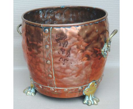 Copper planter with claw feet.