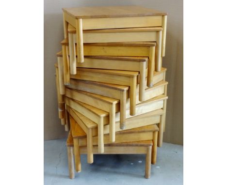 Nine Ercol stacking coffee tables. (9)