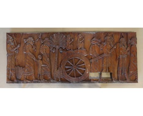 A decorative carved wooden panel, 75x188x6cm.