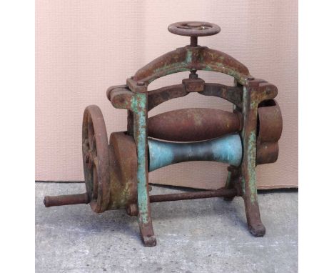 Old metal leather roller.