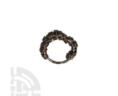 c.3rd millennium BC. A silversmith's hoard comprising a round-section butted silver hoop with twenty-three silver earrings, e