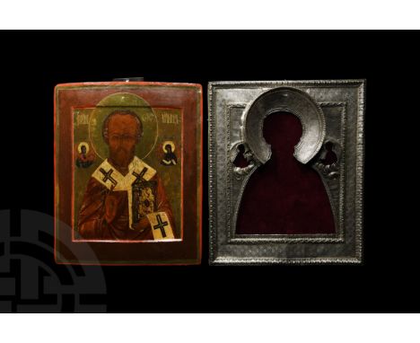 Late 18th century AD. A rectangular wooden icon with two mounting slots to the reverse; facing portrait in oil of St. Nichola