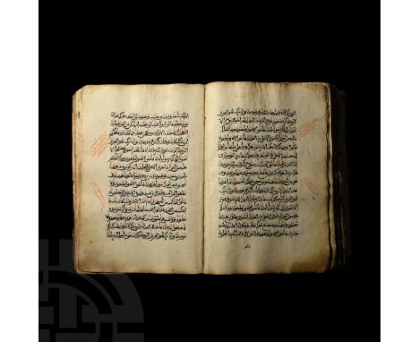 Dated 1256 AH (1840 AD"). A large vellum manuscript of the Qur'an with decorated black and red-brown title pages, dated 1256 