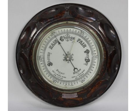A Mid 20th century Carved Oak Mounted Circular Aneroid Barometer with Presentation Plaque Dated 1947, 28cms Diameter 