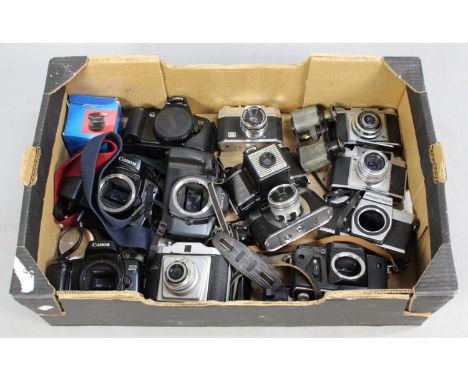 A Collection of Various Vintage Camera Bodies to include Canon, Praktica, Zenith Etc 