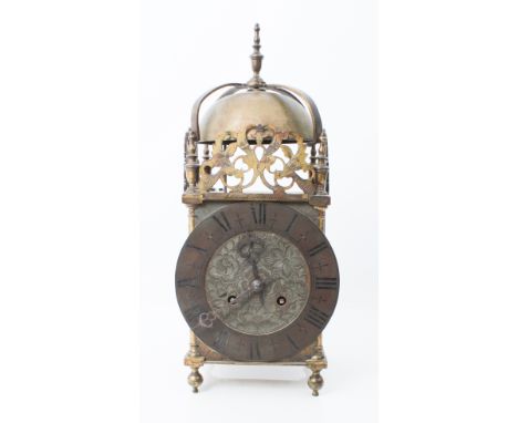 A 17th century style brass lantern clock - early 20th century, the four posted frame case with pierced foliate cresting and a