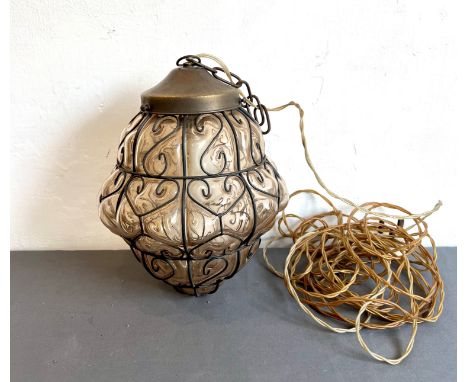A retro 1950s-60s pale smoked glass hall lantern - the blown-moulded lobed glass lantern within a scrollwork wire frame, with