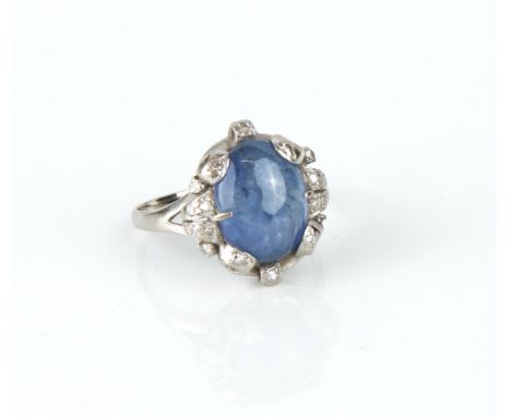 A mid-century 14ct white gold, cabochon cornflower blue sapphire and diamond cluster ring - stamped '14K' and with a Chinese 