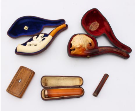 A small group of cased pipes, cigarette holders and a snuff box - comprising a cased Meerschaum pipe by W H Newman Ltd., of s