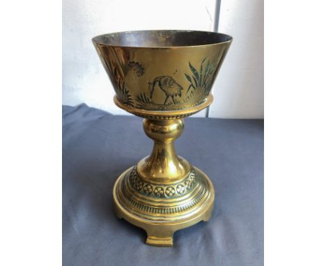 A late-19th century brass oversized chalice in the Orientalist taste - the flared circular bowl chased with cranes and butter