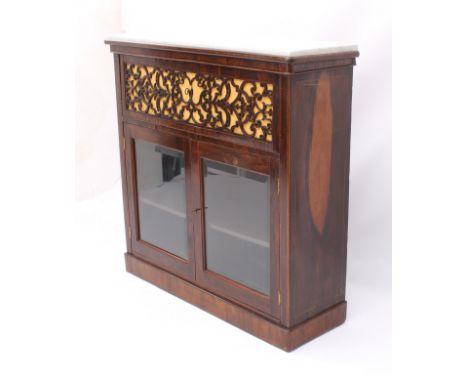 A late-Regency rosewood and marble secretaire bookcase-cabinet - the white Cararra marble top over a fretwork pull-out fall f