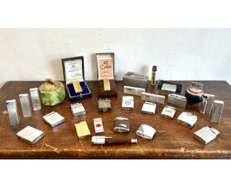 A collection of vintage cigarette lighters - including a 1920s Dunhill plated brass Unique lighter; gold plated Dunhill light