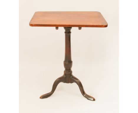 A George III mahogany tilt-top tripod table - the rectangular top on a turned gun-barrel column to three swept supports with 