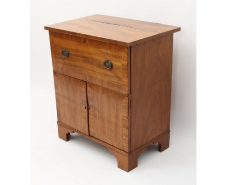 A Regency and later cross-banded mahogany drinks-cabinet - converted from a commode, with hinged top and front and a pair of 