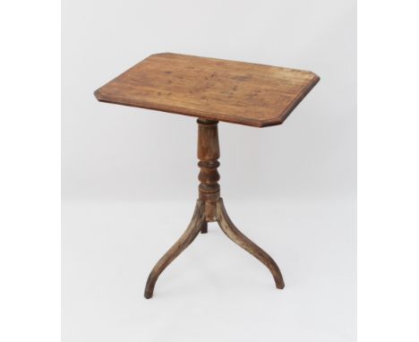 A George III mahogany tilt-top tripod table - the moulded rectangular top with clipped corners, on a turned column to three s