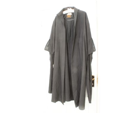 A Ravenscroft & Willis barrister's gown - 1950s, the nametape handwritten in ink 'Rose Heilbron QC' by the celebrated lawyer.