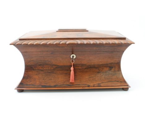 An unusually large late-Regency rosewood sarcophagus tea caddy - with gadrooned border to the hinged cover and mother of pear