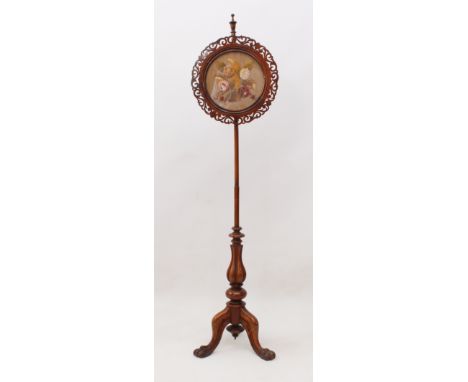 A William IV rosewood pole screen - the circular fretwork screen with a silk, wool and bead embroidered floral bouquet, raise