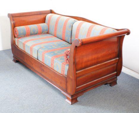 A cherrywood sleigh-style double sofa-bed by And So To Bed - with a panelled back, panelled scroll arms and flared feet, with
