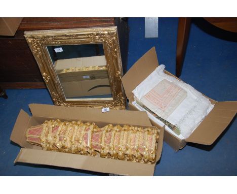A box of light shades, gilt framed mirror, box of linen and music books.