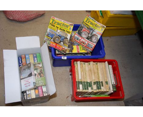 Three boxes of books, videos and tractor magazines and glasses.
