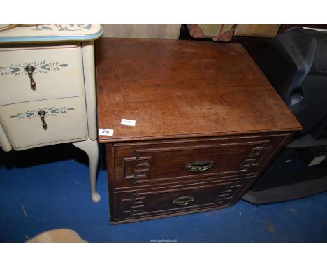 A commode, 25" x 21" x 2' high.
