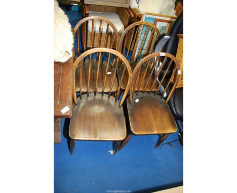 Four stick back chairs.