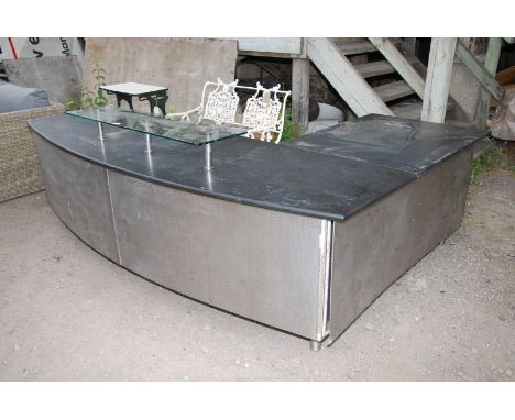 A reception desk with granite top and glass extension shelf, 98 1/2" x 31 1/2".