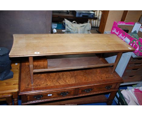 A mid century style coffee table with lower shelf, 47 1/2"£ x 16" x 14" high.