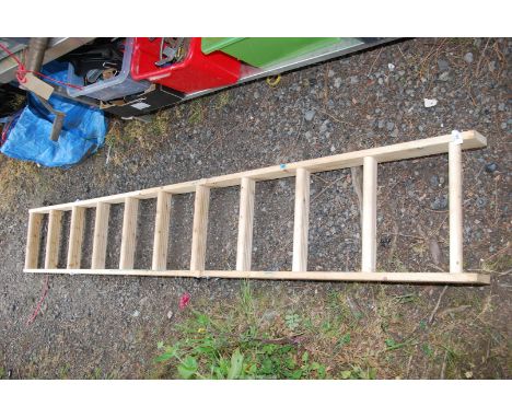 A wooden fold up three stage loft ladder, eleven rungs.
