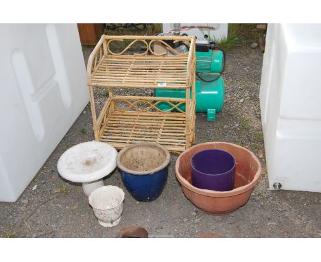 A bamboo shelf unit, small bird bath two glazed pots and one other.