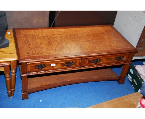 A coffee table, maple veneer, with lower shelf and two drawers.