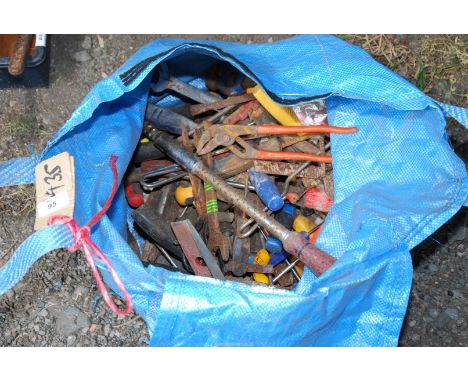 Plastic bag of tools, Stilsons, spanners etc.