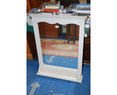 A wall hanging mirror with lower shelf, 25" wide x 33" high.