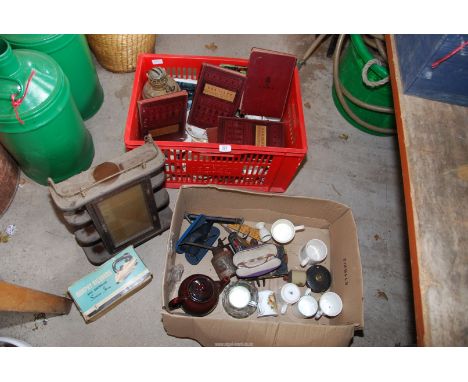 A brass oil lamp, old books, Collie mug, tape etc.