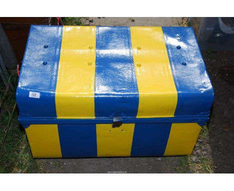 A painted metal trunk.