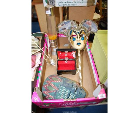 A Venetian mask, music box, lava lamp etc.