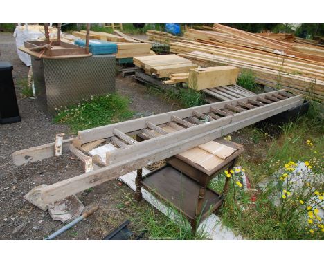 A twelve rung ladder for decorative purposes only, no metal safety bar.