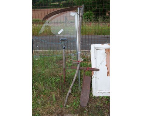 An old hay knife, scythe and fork.
