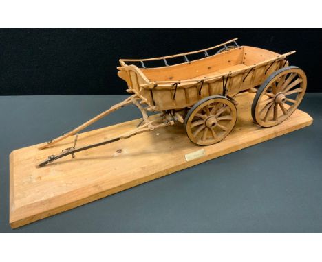 An early 20th century 1/8th scale model of a North Monmouth-shire farm wagon, 65cm long x 22.5cm wide. 