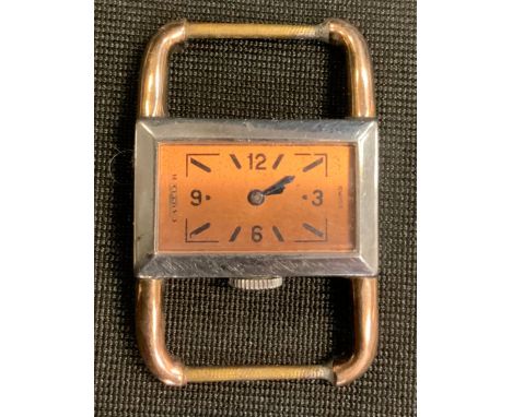 A Cartier/Le Coultre ladys Art Deco wristwatch head, two tone rose gold and silver coloured case with open arched shoulders, 
